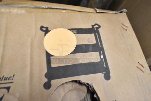 Cardboard box with printed image of a cart and orange sticker, indicating it contains new scratch and dent items.