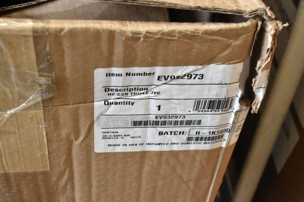 Cardboard box showing Everpure EV9329-73 High Flow CSR Triple-7FC Water Filtration System, new with scratch and dent, item number and description on label.