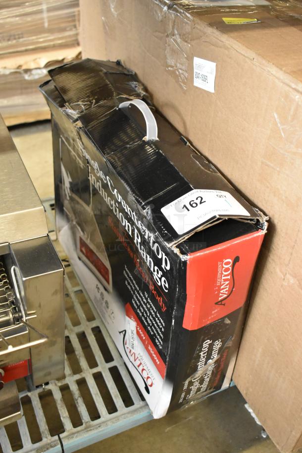Brand new Avantco IC3500 countertop induction range, 208-240V, 1 phase, in scratched packaging with visible dents.