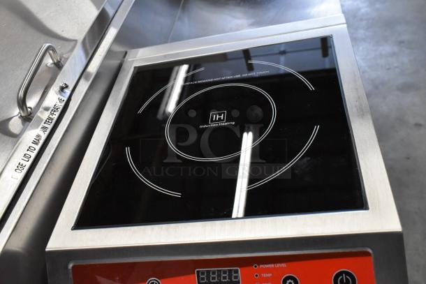 Brand new Avantco 177IC3500 countertop induction range, 208-240V, 1 Phase; black glass cooktop with digital controls, minor surface scratches visible.