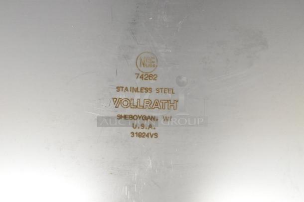 Close-up of Vollrath 74262 stainless steel deli pan marking. Shows NSF certification, item number, and manufacturing details.