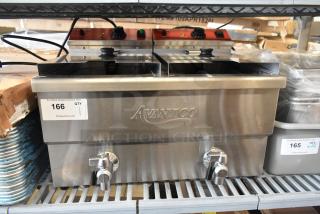 Brand new Avantco 177F202 30 lb. dual tank electric countertop fryer with two metal fry baskets and lids, 208-240 Volts, 1 phase.