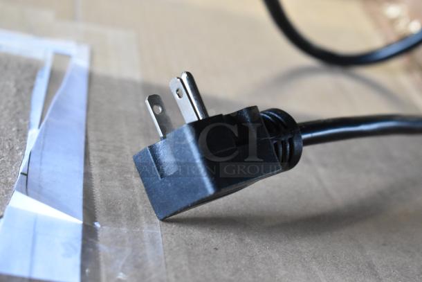 Close-up of a power plug from a brand new Avantco 177F202 electric countertop fryer, 208-240V, 1 phase.