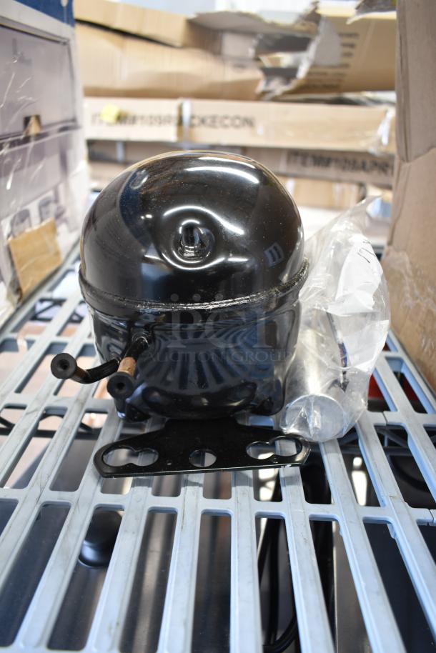 New Embraco EMC3134U compressor for various unit models, 115V, R-290. Slight scratches visible; otherwise in new condition.