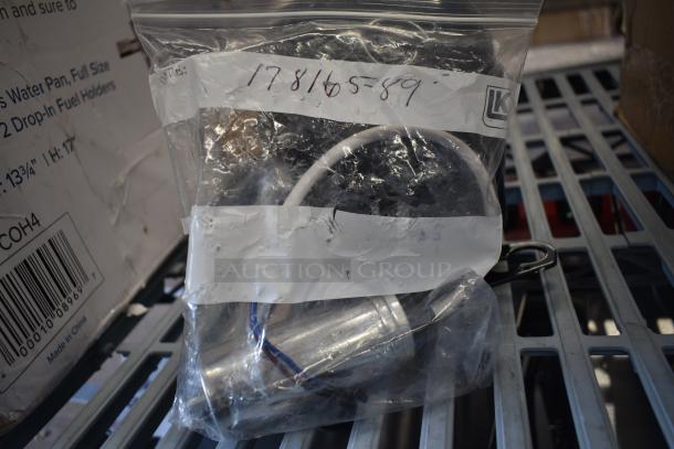 Brand new Embraco EMC3134U compressor in packaging, labeled "17816589," compatible with A-19F-HC series, 115V, R-290.