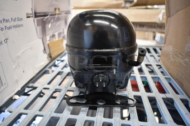 Brand new Embraco EMC3134U 17812363 compressor, 115V, R-290, for several A and SS series units, minor scratches visible.