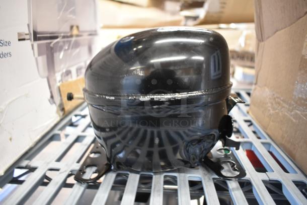 Brand new Embraco EMC3134U compressor, 115V, R-290, for various series units. Black, slight scratches, no box.