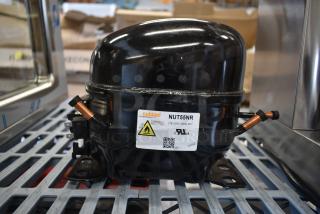 Brand new Cubigel NUT55NR compressor, slight scratches, for Avantco and UBB/UDD series. Label: 115-127V, 60Hz, R290.