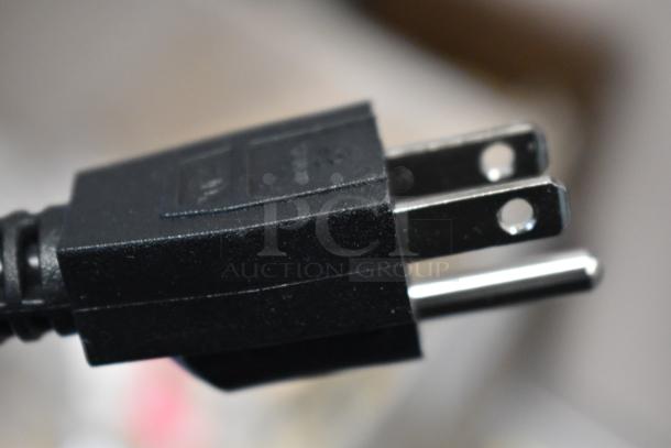 Close-up of the plug for the Avantco 177C15 pourover airpot coffee brewer, showing a standard electrical connection.