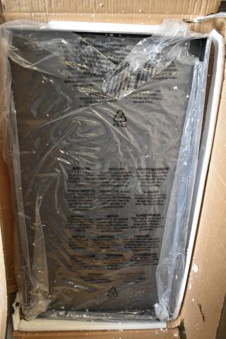 Brand new G703-9600-C1 griddle top, scratch and dent condition, in original packaging with protective plastic and warning labels.