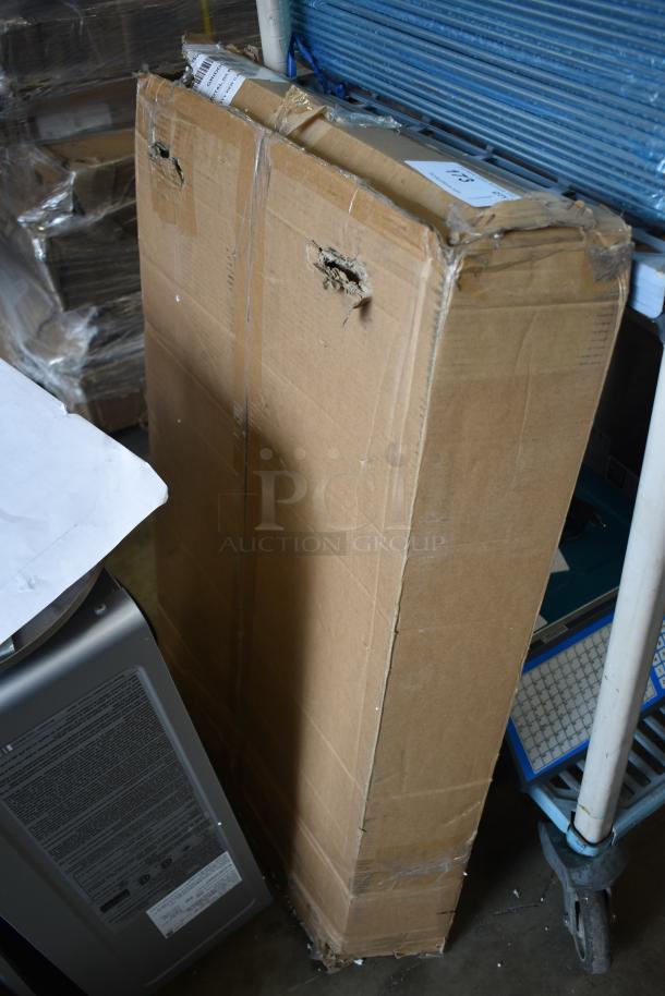 Cardboard box containing a BRAND NEW G703-9600-C1 griddle top, marked "Scratch and Dent," with shipping labels visible.