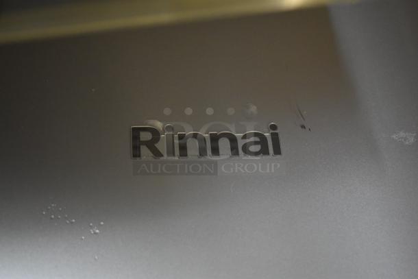 Brand new Rinnai RX199iN tankless water heater, 199,000 BTU, 11.0 GPM, scratch and dent condition with visible marks.