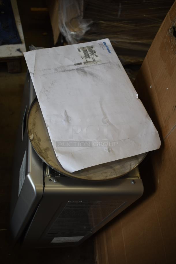 Rinnai RX199iN tankless water heater, 199,000 BTU, wall-mounted, scratch and dent condition with visible packaging materials.