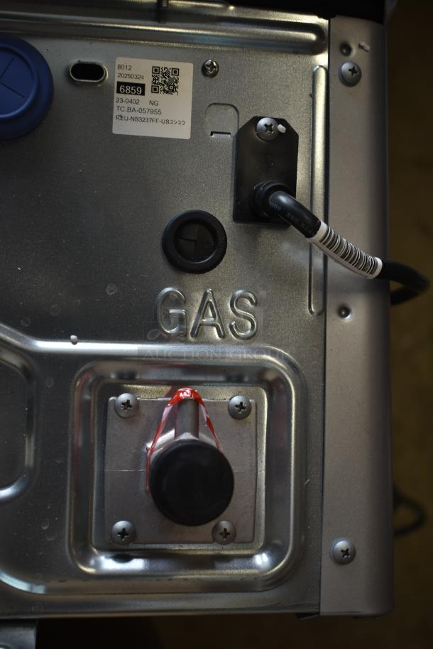 Brand new Rinnai RX199iN tankless water heater, 199,000 BTU. Visible gas input and label markings.