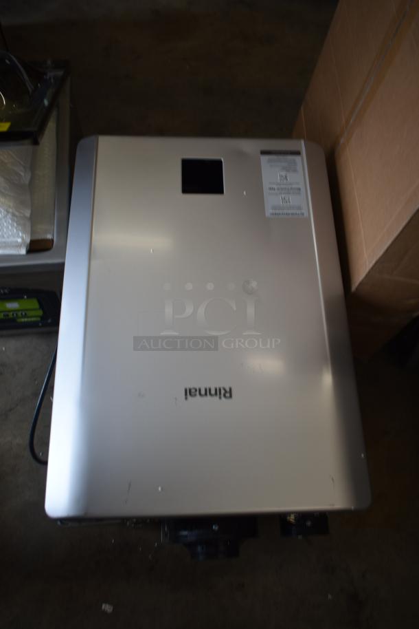 Rinnai RX199iN tankless water heater, new with minor scratches, model label visible, 199,000 BTU, 11.0 GPM.