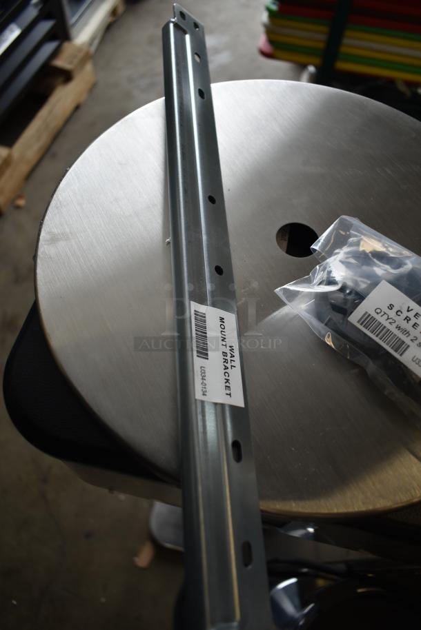 Wall mount bracket for a Rinnai RX199iN tankless water heater, labeled with barcode. Includes screws in bag.