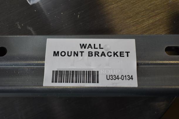 Rinnai RX199iN tankless water heater bracket, labeled "Wall Mount Bracket" with barcode U334-0134.