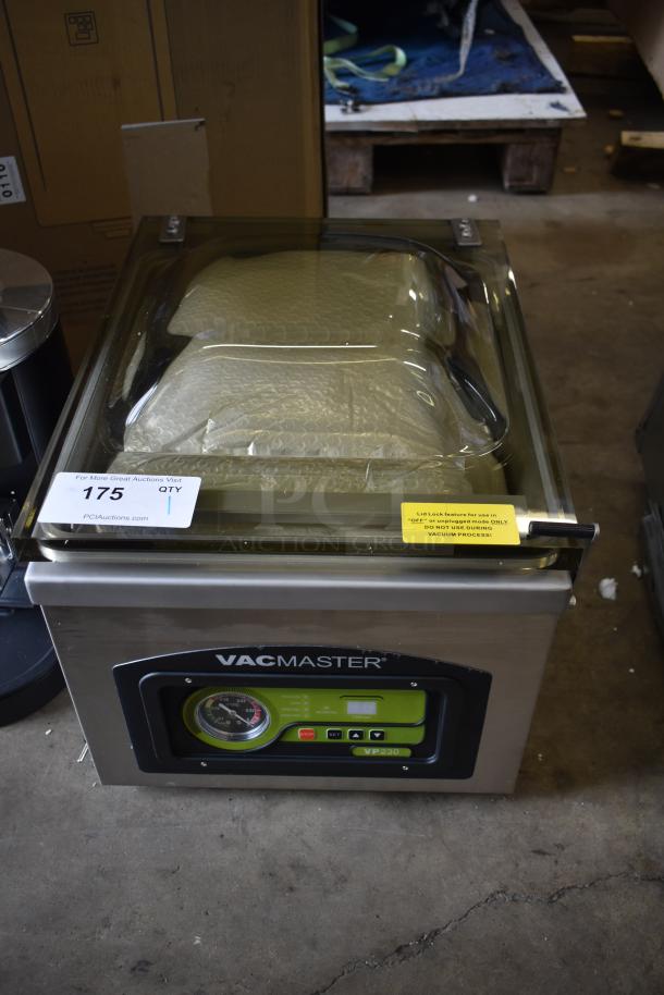 Brand new VacMaster VP230 chamber vacuum machine with 12 1/4" seal bar, noted scratch and dent. Includes voltage and usage labels.