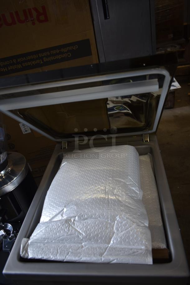 VacMaster VP230 Chamber Vacuum Packaging Machine, brand new, 12 1/4" seal bar, 115V, 1 phase, with bubble wrap inside.