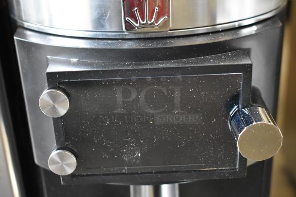 Brand new Mahlkonig E65W Espresso Grinder, black, 2.6 lb capacity, minor scratches. 120V, 1 Phase. Grind-by-Sync technology.