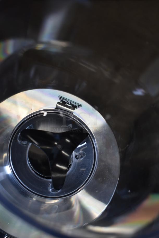 Brand new Mahlkonig E65W grinder, black, with minor scratches. 120V, 1 Phase, 2.6 lb capacity. Mahlkonig logo visible.