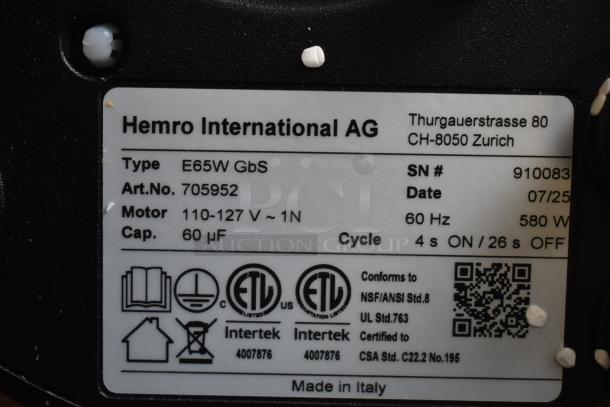 Brand new 2025 Mahlkonig E65W GBS espresso grinder label, showing specifications and compliance certifications.