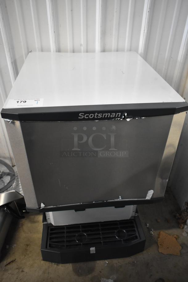 Brand new Scotsman HID525AB-1A Meridian ice machine with minor dents, 25 lb. bin storage, push button dispensing.