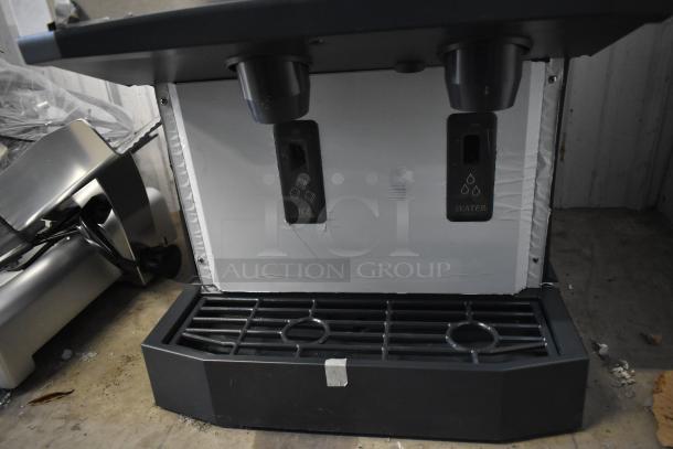 Brand new Scotsman HID525AB-1A ice and water dispenser, 25 lb. capacity, push button operation, minor dents visible.