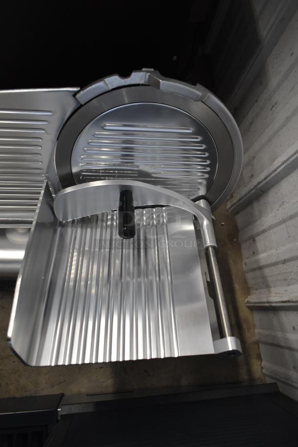 Brand new Avantco 177SL312 12" manual meat slicer, gravity feed, 115V, scratch and dent condition.