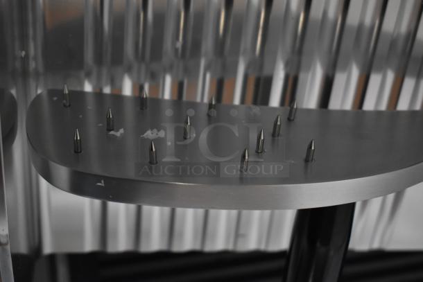 Avantco 177SL312 12" manual gravity feed meat slicer, showing sharp blade mechanism, 115V, slight scratch marks.