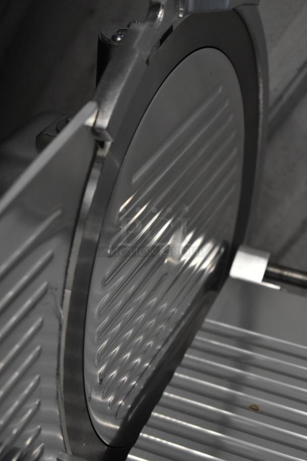 Brand new Avantco 177SL312 12" manual meat slicer, 115V, 1 Phase. Slight scratch, durable construction, gravity feed design.