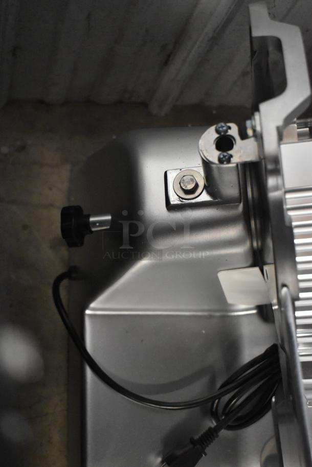 Avantco 177SL312 12" Manual Meat Slicer, 115V, 1 Phase, showing feed mechanism. Brand new with minor scratches.