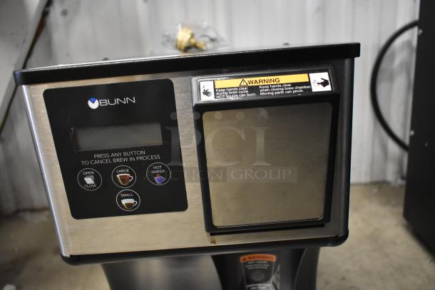Brand new Bunn 44500.0000 My Cafe MCO Single Serve Brewer, scratch and dent. Features digital controls, warning labels visible.