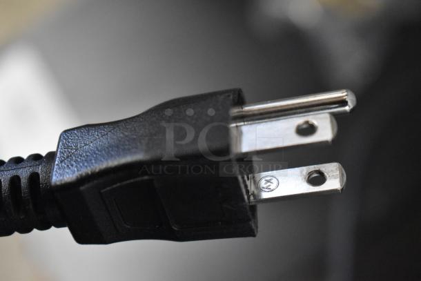 Power plug of a Bunn 44500.0000 My Cafe MCO Brewer, close-up view. Item is brand new with minor scratches and dents.