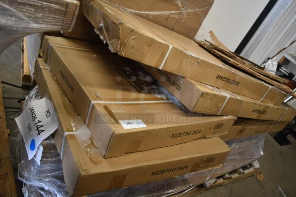 Stack of Bunn scratch and dent items in boxes, including tables. Boxes indicate model 522ETSG 2424. Visible wear on packaging.