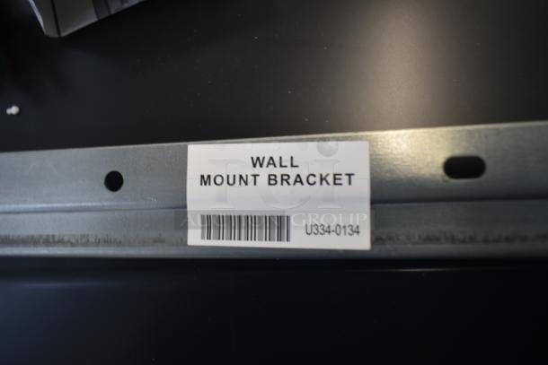 Wall mount bracket label for Rinnai CX199i tankless water heater. Label reads "Wall Mount Bracket" with barcode U334-0134.