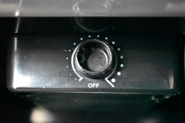 Close-up of the control dial on a Danby DAR044A1SSO refrigerator, showing temperature settings.