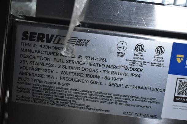 ServIt 423HDM26SA heated display case label, detailing 26" stainless design, 120V, 1 phase, IPX4 rating, broken glass visible.