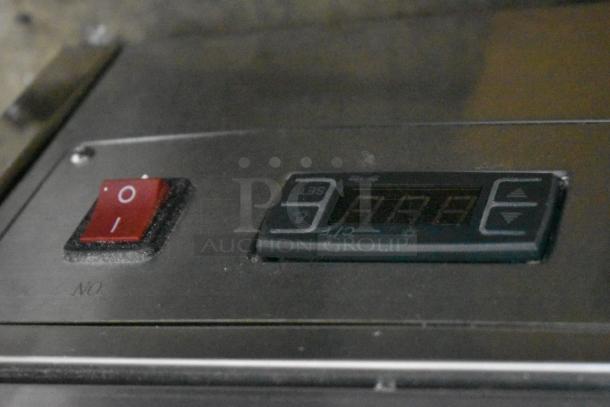 Control panel of ServIt 423HDM26SA heated display case with power switch and digital temperature display. Scratch and dent condition.