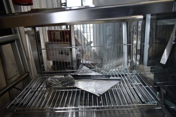 "ServIt 423HDM26SA 26” heated display case, 3 shelves, sliding doors, visible broken glass, 120V, 1 phase, new scratch and dent."