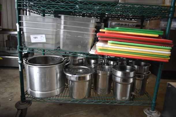 Two-tier lot with cutting boards and stainless steel cylindrical bins on a metal rack. Includes plastic storage bins.
