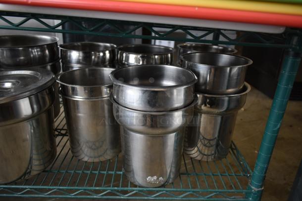 Two-tier lot with cutting boards and stainless steel cylindrical bins; various sizes, stacked on green metal shelving.