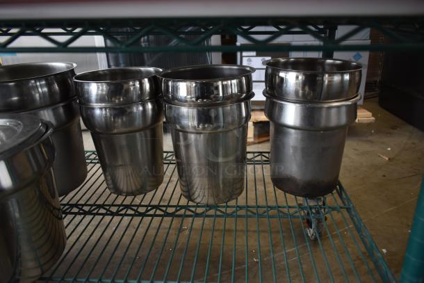 Two-tier auction lot featuring stainless steel cylindrical bins on a metal rack. Some bins show slight wear.