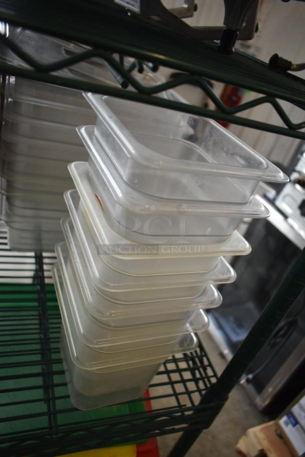 Stack of poly drop-in bins on wire shelving, various sizes, clear material, used condition. Ideal for food service storage.