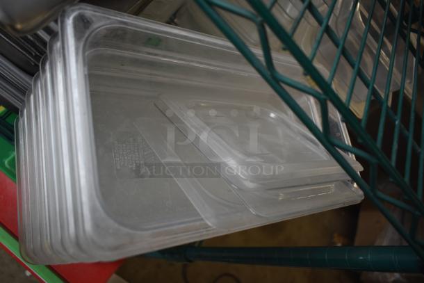 Assorted stainless steel and poly drop-in bins, stacked, in good condition, visible markings indicate model details.