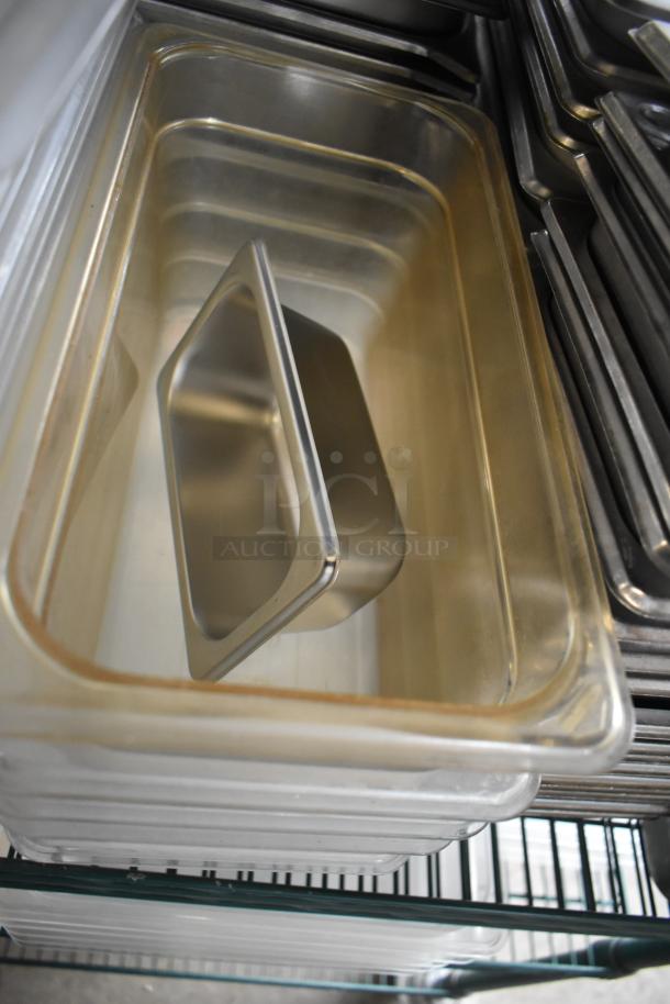 Stainless steel and poly drop-in bins, stacked, showcasing durable construction and multi-size variety, excellent condition.