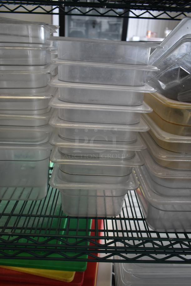 Alt text: Stack of transparent poly drop-in bins on a metal rack, including various sizes, suitable for storage.