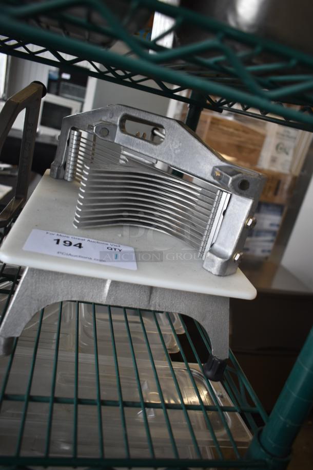 Vollrath 25721VK countertop tomato slicer with metal blades, sturdy frame, and non-slip base. Auction tag: "194 QTY 1".