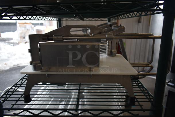 Vollrath 25721VK countertop tomato slicer in used condition, featuring stainless steel blades and sturdy metal construction.