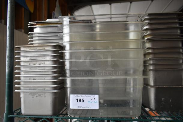 Stacked stainless steel and poly drop-in bins, some marked "Vollrath." Auction lot tag "195 QTY Tier Lot" visible.